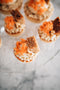 carrot cake tart made from vanilla shortcrust pastry, carrot cream filling, carrot jelly, mascarpone cream, carrot cake, walnuts, white chocolate pearls, grated carrot and cinnamon made fresh by tartlet bakery